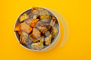 Homemade Cooked Sweet Potato with spices and herbs in smal bowl