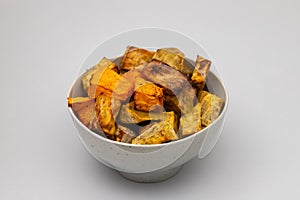 Homemade Cooked Sweet Potato with spices and herbs in smal bowl