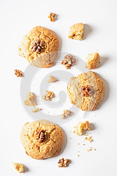 Homemade cookies chocolate chips with nuts on a white background, top view