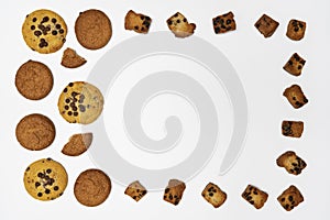 Homemade cookies with chocolate, nuts and coffee beans on a white background.