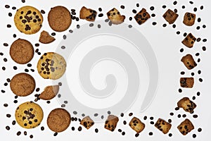 Homemade cookies with chocolate, nuts and coffee beans on a white background.