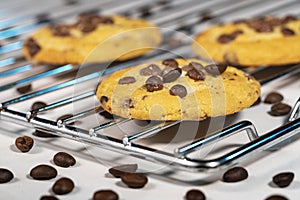 Homemade cookies with chocolate, nuts and coffee beans on a white background.