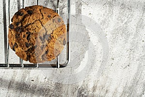 Homemade cookies with chocolate, nuts and milk on a wooden table and an art phone in the morning. Close up. Breakfast.