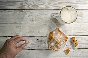 Homemade cookies with chocolate, nuts, raisins, milk on a wooden background. Breakfast.