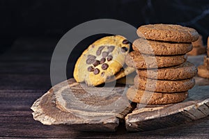 Homemade cookies with chocolate, nuts on a wooden background