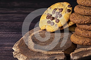 Homemade cookies with chocolate, nuts on a wooden background