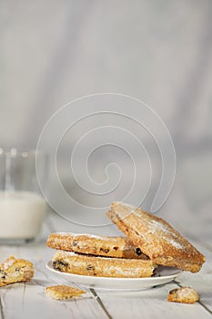 Homemade cookies with chocolate, nuts on a wooden background