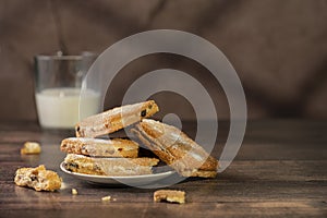 Homemade cookies with chocolate, nuts on a wooden background