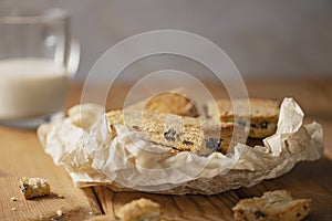 Homemade cookies with chocolate, nuts on a wooden background