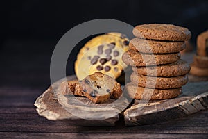 Homemade cookies with chocolate, nuts on a wooden background  with a background blur.