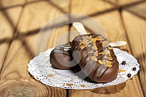 Homemade cookies with chocolate, nuts on a wooden table and an art background in the morning. Close up. Breakfast.