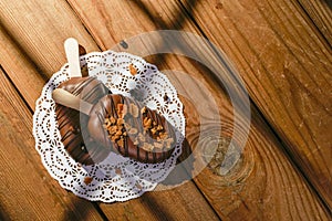 Homemade cookies with chocolate, nuts on a wooden table and an art background in the morning. Close up. Breakfast.