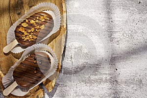 Homemade cookies with chocolate, nuts on a wooden table and an art background in the morning. Close up. Breakfast.