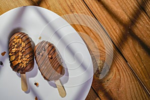 Homemade cookies with chocolate, nuts on a wooden table and an art background in the morning. Close up. Breakfast.