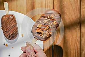 Homemade cookies with chocolate, nuts on a wooden table and an art background in the morning. Close up. Breakfast.