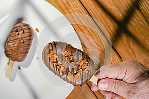 Homemade cookies with chocolate, nuts on a wooden table and an art background in the morning window light. Close up. Breakfast.