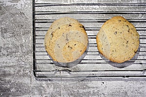 Homemade cookies with chocolate, nuts on a wooden table and an art background in the morning window light. Close up. Breakfast.