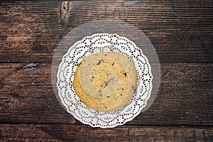 Homemade cookies with chocolate, nuts on a wooden table and an art background in the morning window light. Close up. Breakfast.