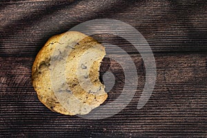 Homemade cookies with chocolate, nuts on a wooden table and an art background in the morning window light. Close up. Breakfast.