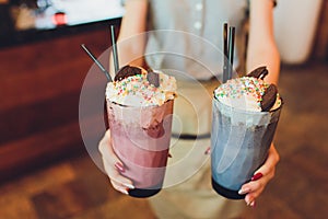 Homemade Cookies and Cream Milkshake in a Tall Glass.