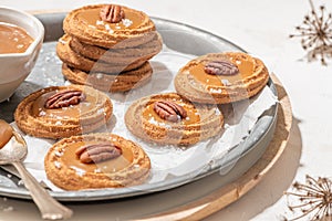 Homemade cookies with a generous dollop of Salted Caramel and pecan nut