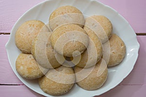 Homemade cookies on a white dish close-up. Fresh baked goods. Home cooking concept