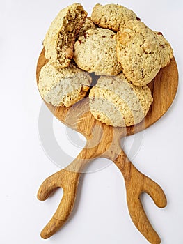 Homemade cookies on a wooden kitchen Board on a white background.