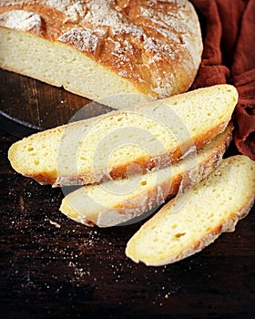 Homemade corn bread on a dark wooden table