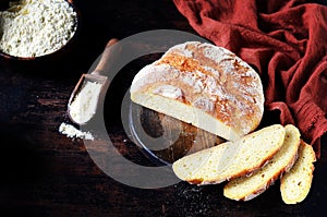 Homemade corn bread on a dark wooden table