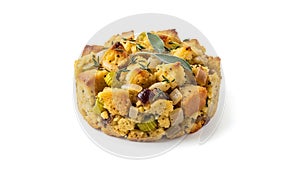 Homemade cornbread stuffing with herbs and vegetables, isolated on white background