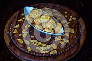 Homemade Cornflake cookies on a wooden background.