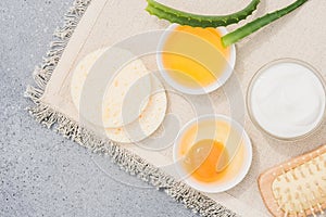 Homemade cosmetics with natural ingredients - egg yolk, herbal honey, aloe vera and greek yogurt