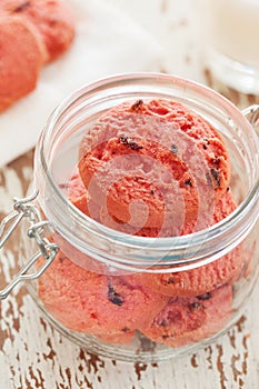 Homemade cranberry cookies in widemouthed glass jar