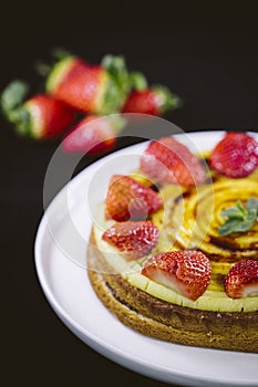 Homemade cream layer cake, fresh, colorful, and delicious dessert with juicy strawberries.