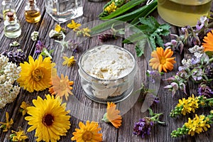 Homemade cream made from herbs, essential oils and shea butter