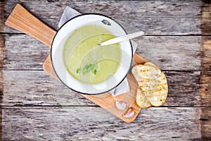 Homemade cream soup with asparagus and toasted ciabatta