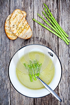Homemade cream soup with asparagus and toasted ciabatta
