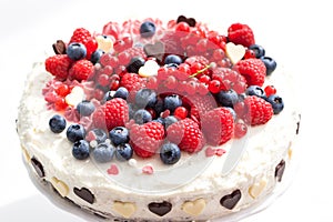 Homemade creamy cake decorated with fresh berries