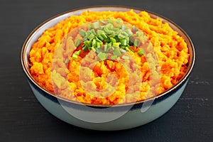Homemade Creamy Mashed Sweet Potatoes with MIlk and Butter in a Bowl, side view