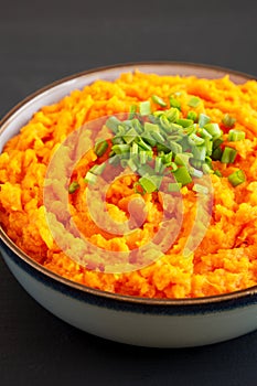 Homemade Creamy Mashed Sweet Potatoes with MIlk and Butter in a Bowl, side view