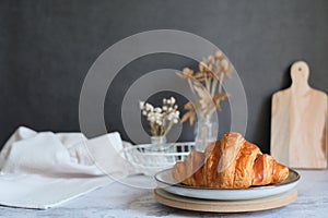 Homemade croissant on the kitchen table top. pastry and bakery or breakfast concept with Copyspace. horizontal