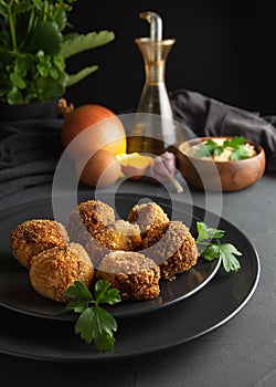 Homemade croquettes on dark wooden background - image