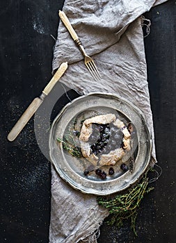 Homemade crostata or galette with blueberries photo