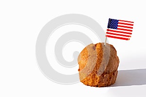 Homemade cupcake with USA flag on white background, copy space. Holiday Independence Day. American flag