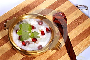 Homemade curd rice south indian food with pomegranate and lemon pickle