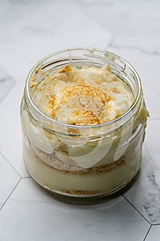 Homemade Custard Banana Pudding with Baby Biscuit Powder. Turkish Magnolia Dessert in Glass Bowl