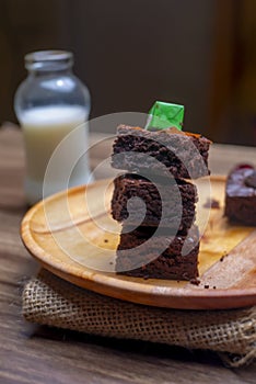 Homemade dark chocolate fudge brownies cake with fresh milk