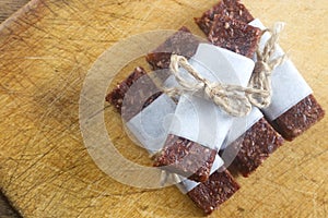 Homemade date bars on the wooden board