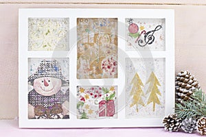 Homemade decoupage Christmas decorations in a photo frame