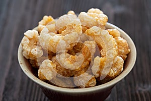 Homemade deep fried crispy pork rind in bowl